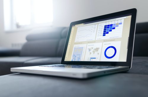 A gray laptop with graphics on the screen